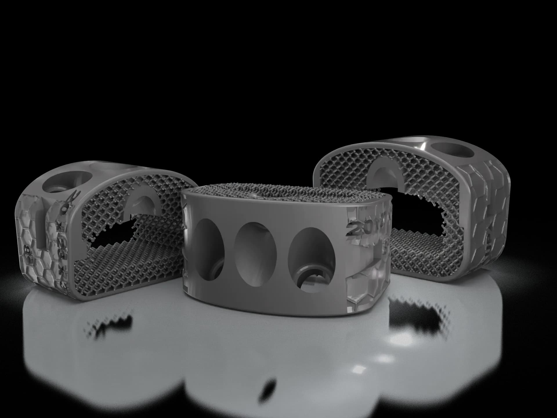 Tres cages intersomáticos de titanio con estructura trabecular interna